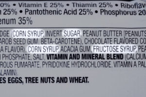34563855 - closeup of ingredients list of granola health bar with forms of sugar highlighted